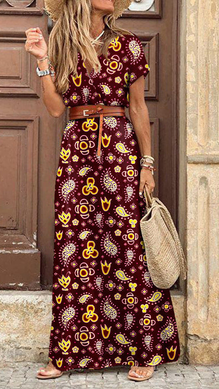 Abito lungo elegante con motivo paisley e cintura coordinata